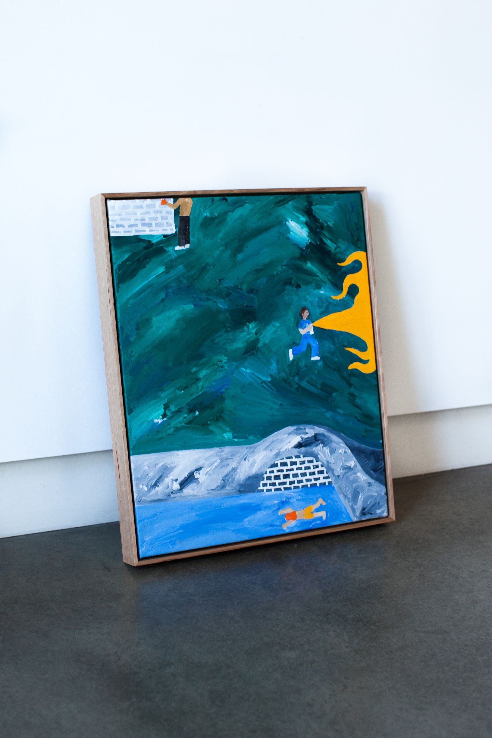 Painting with blue, in yellow shorts, 2021